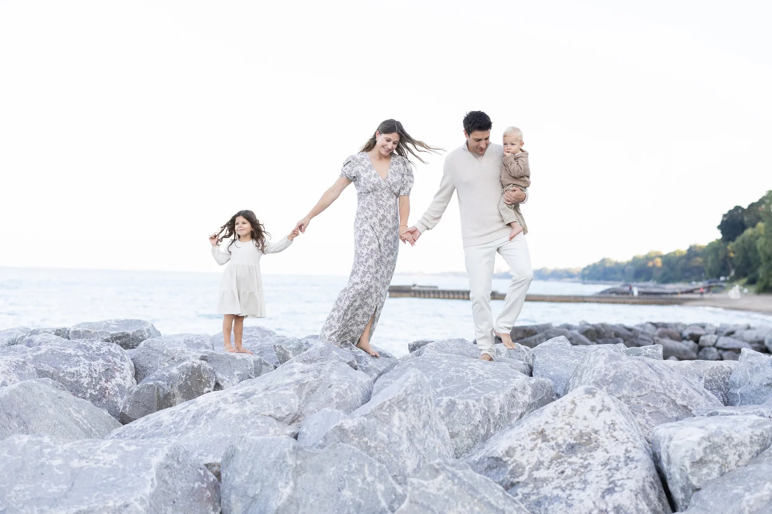 A family together outdoors, photographed by Elyse