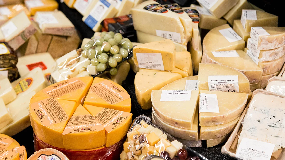 A picture of some of the curated gourmet cheeses at Vintage Grocers