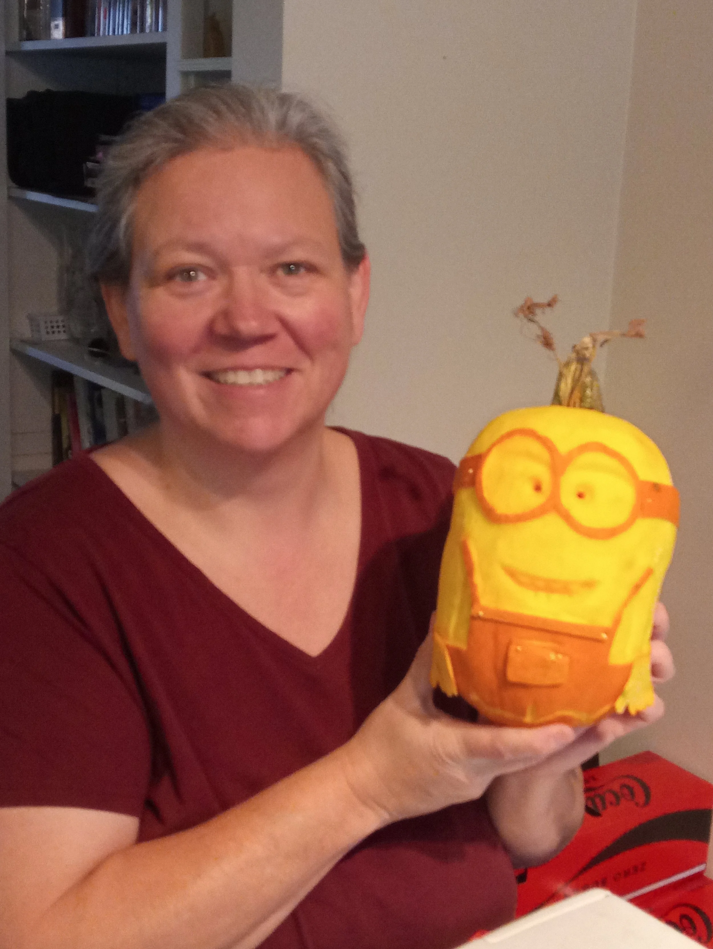 pumpkin carving of minion with artist Deb Laninga