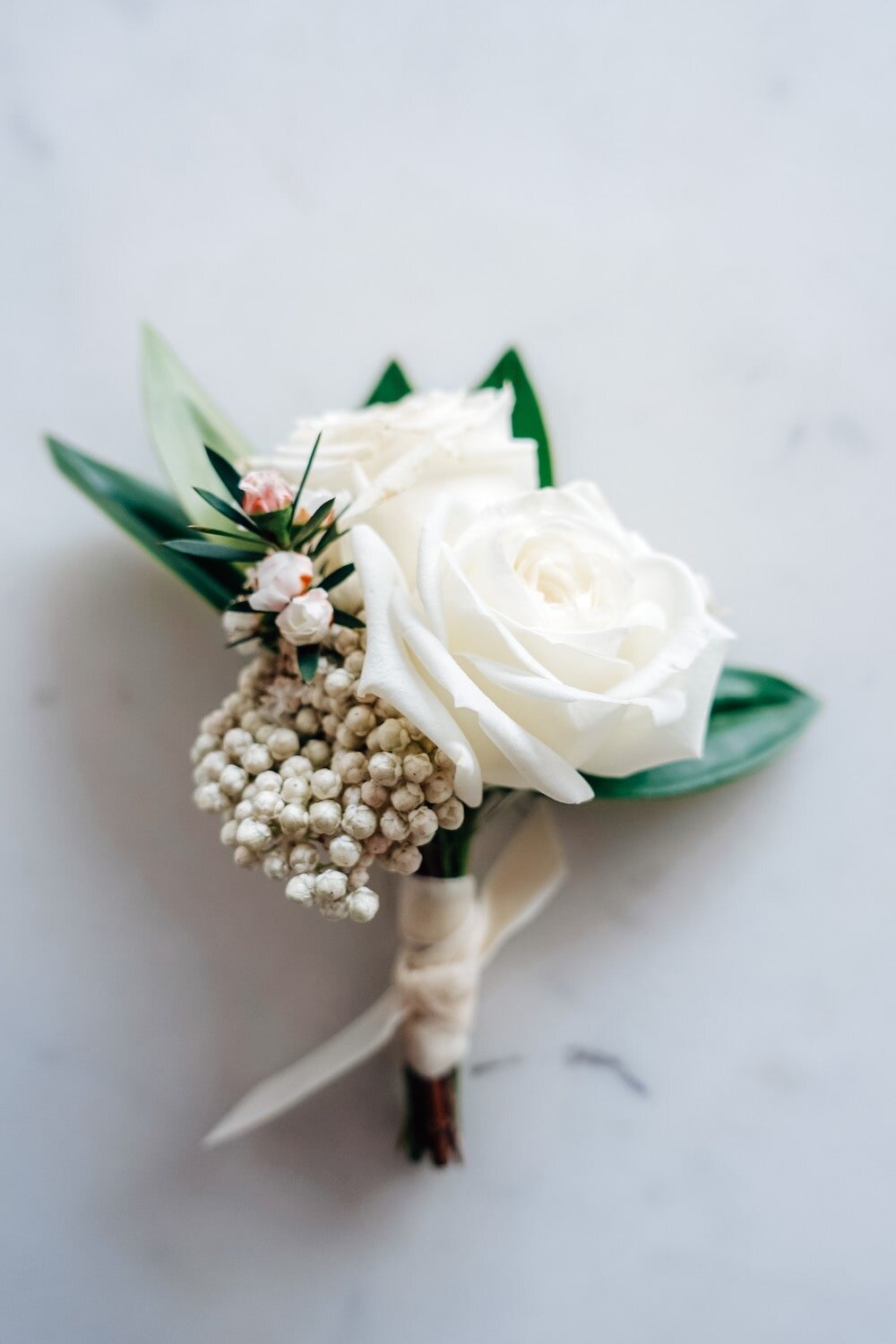 White and green pin corsage
