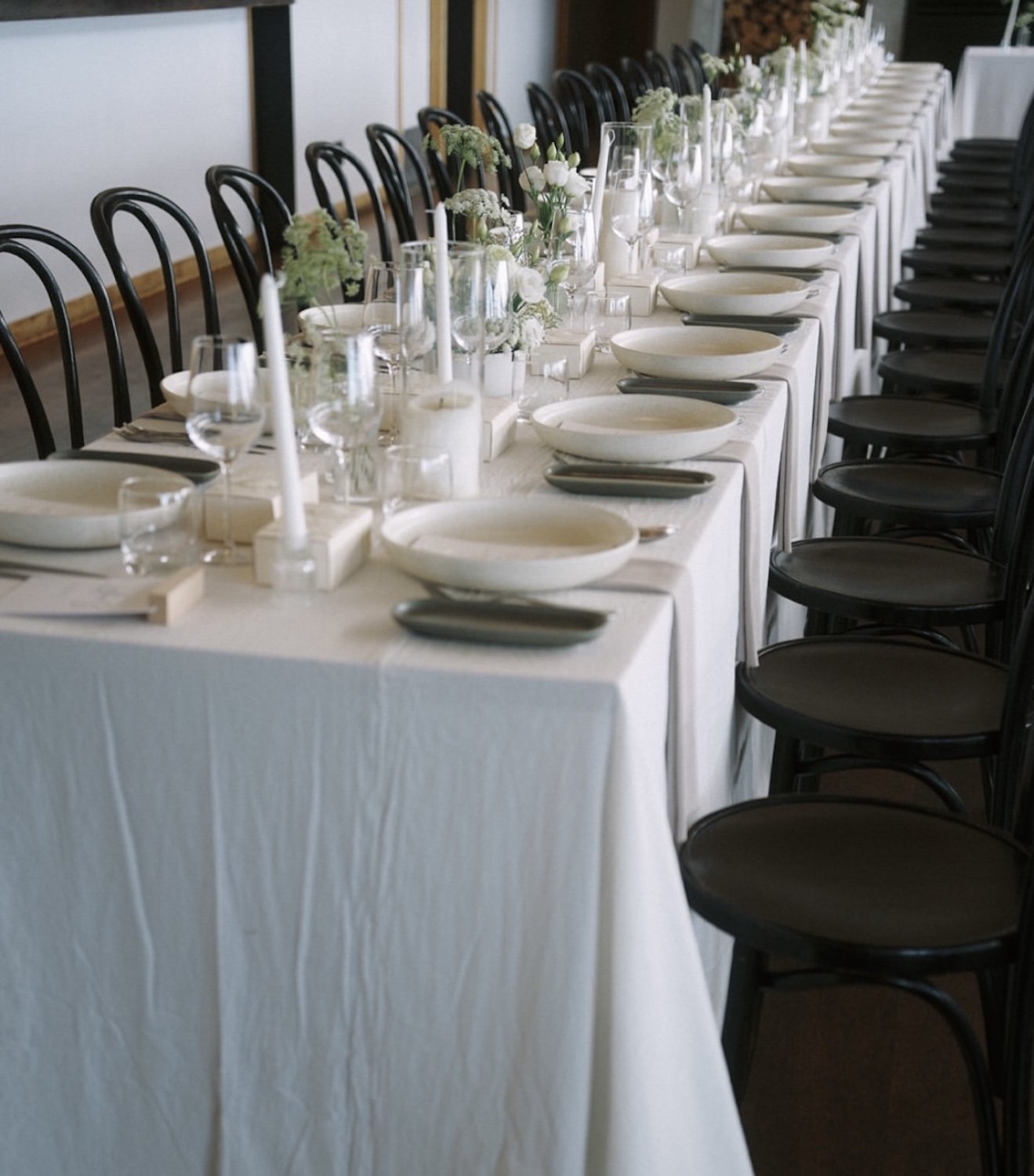 Elegant reception flowers and candle styling for an Auckland wedding.