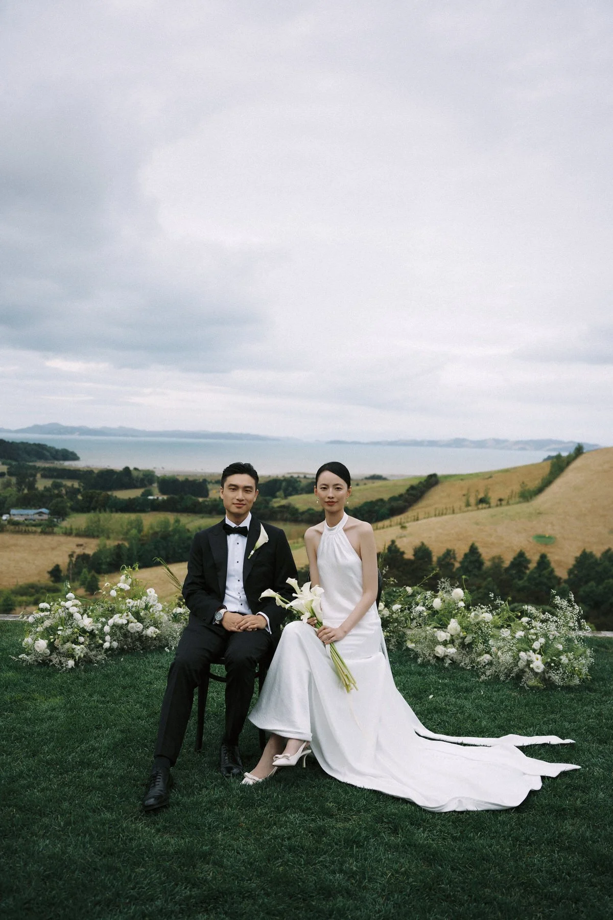 Meadow-inspired ceremony flowers overlooking the coast at Kauri Bay Boomrock.