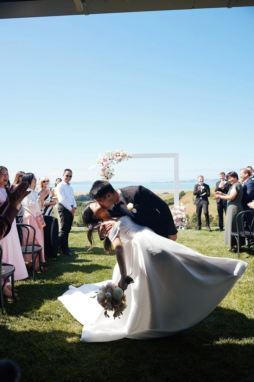 newlyweds have a moment at the end of the aisle