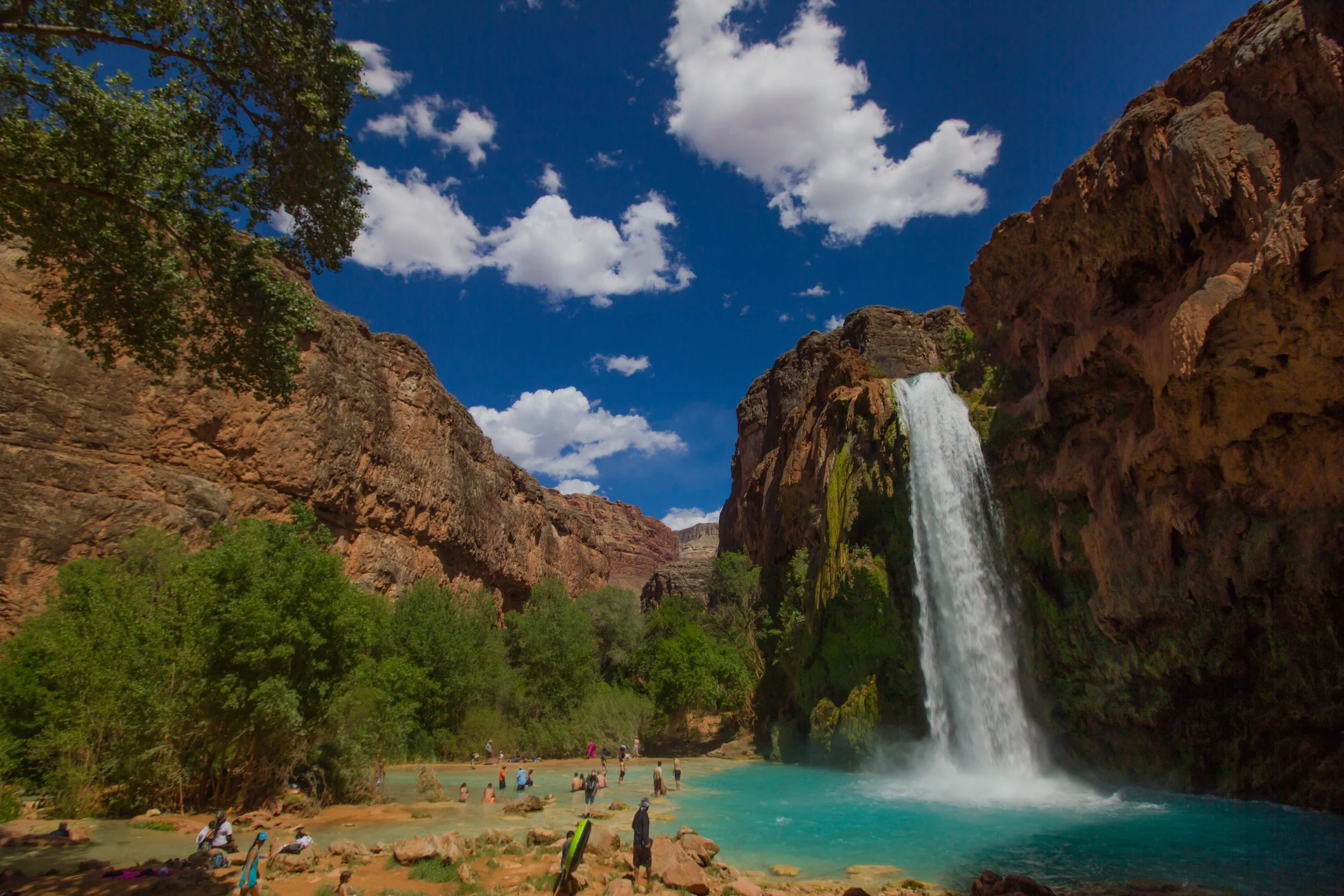 Turquoise water flowing over Havasu Falls in Supai, Arizona