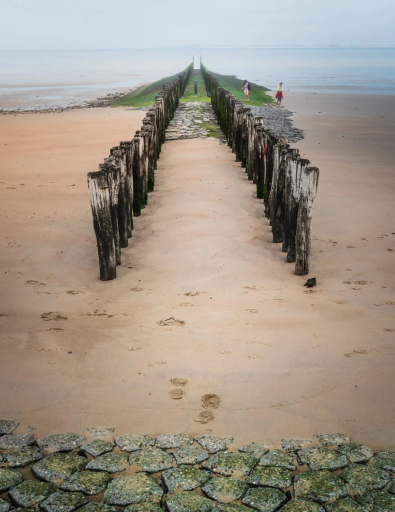 Netherlands-zeeland-beach-pillars-with-people-790x1024.jpg