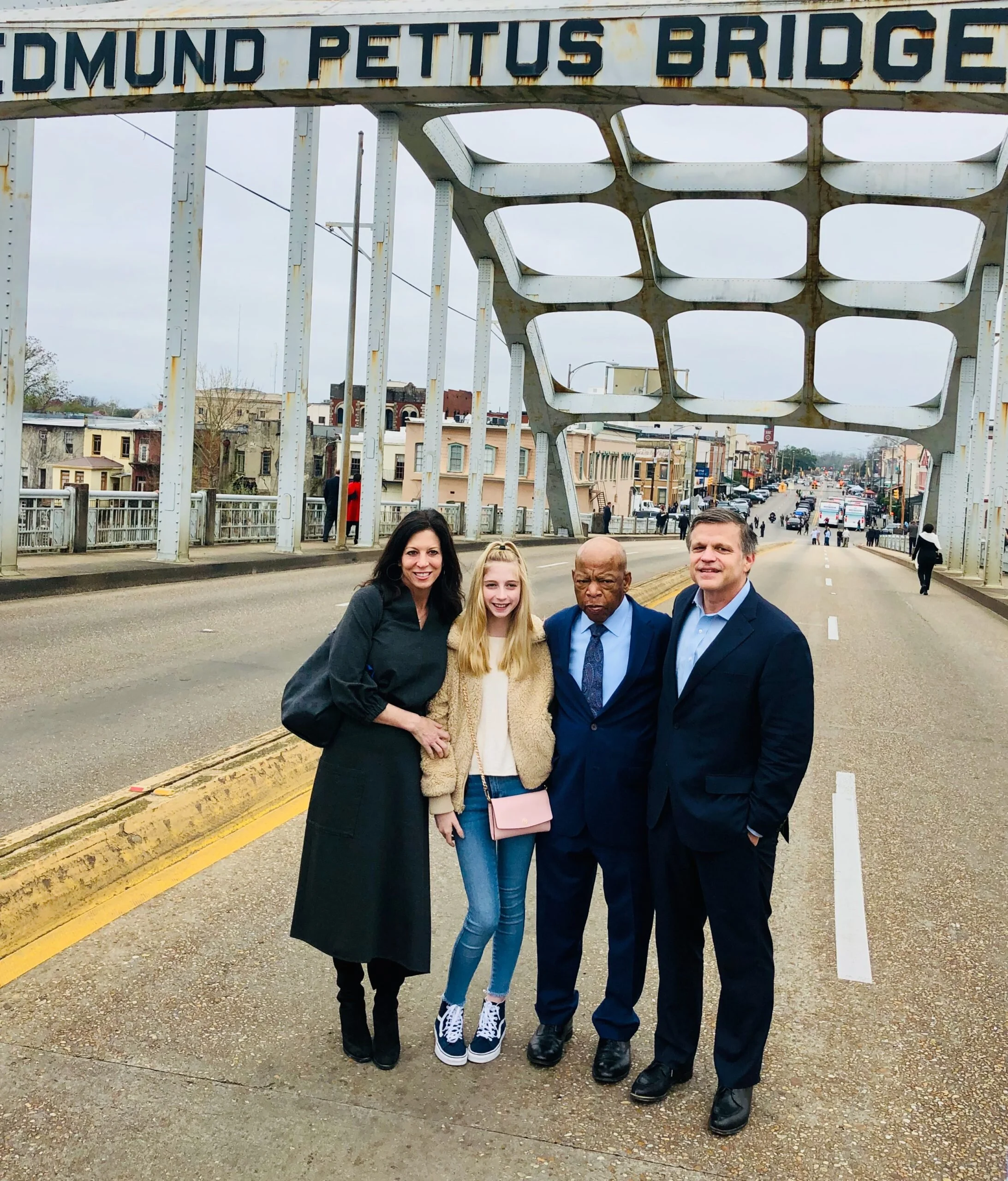 [Brinkley, wife Anne and daughter Cassady, with John Lewis on the Edmund Pettus Bridge]