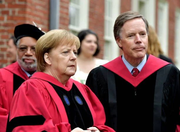 Burns with Chancellor Angela Merkel at Harvard’s 2019 Commencement.