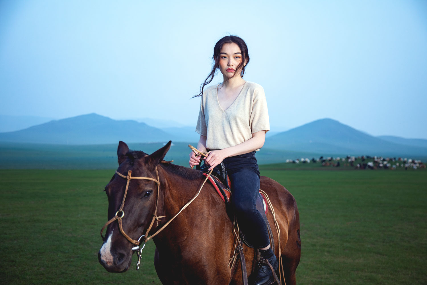 cashmere-v-neck-tee-model-on-horse-horizontal-born-of-nomad.jpg