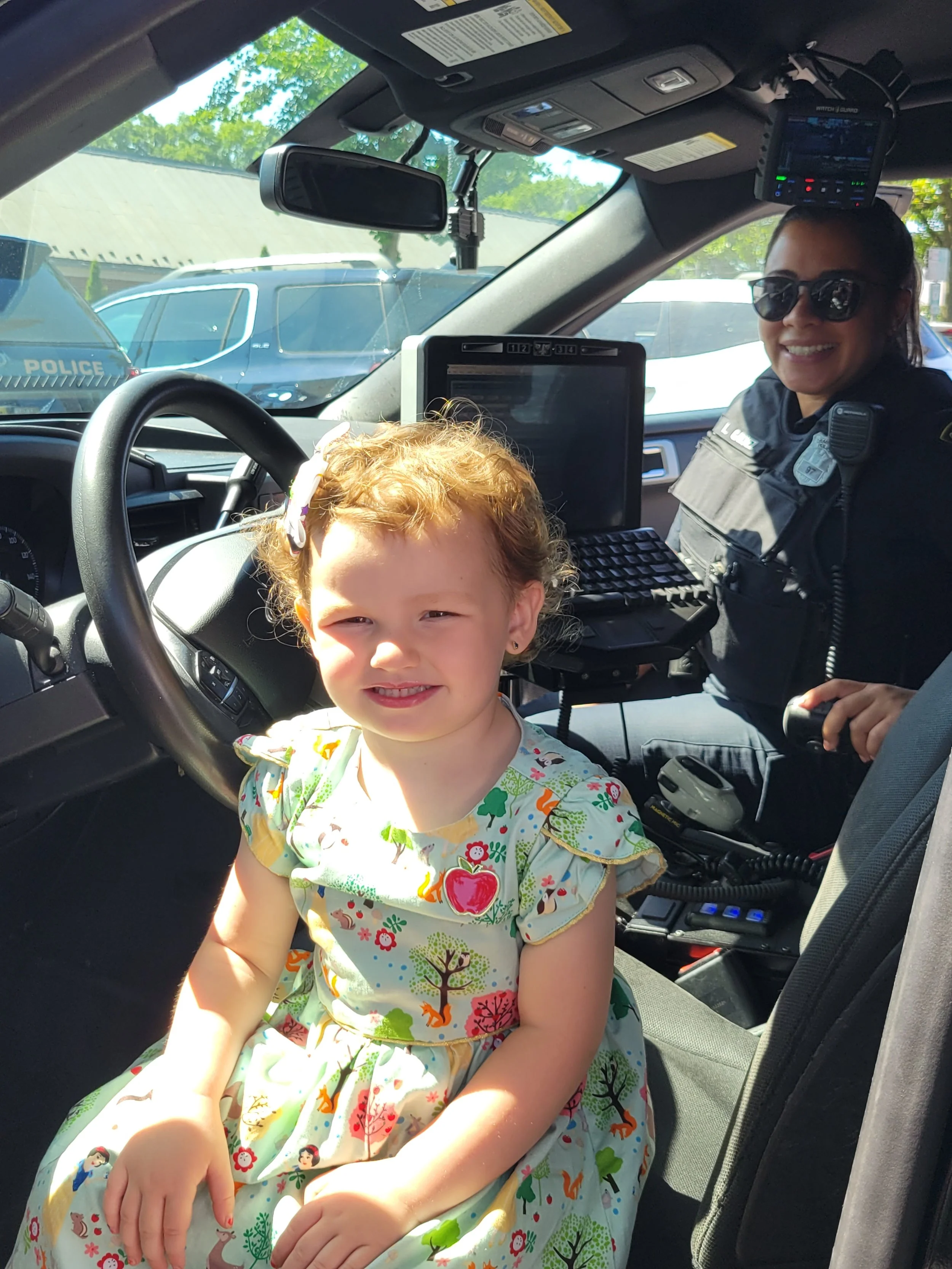 Girl in police car.jpg
