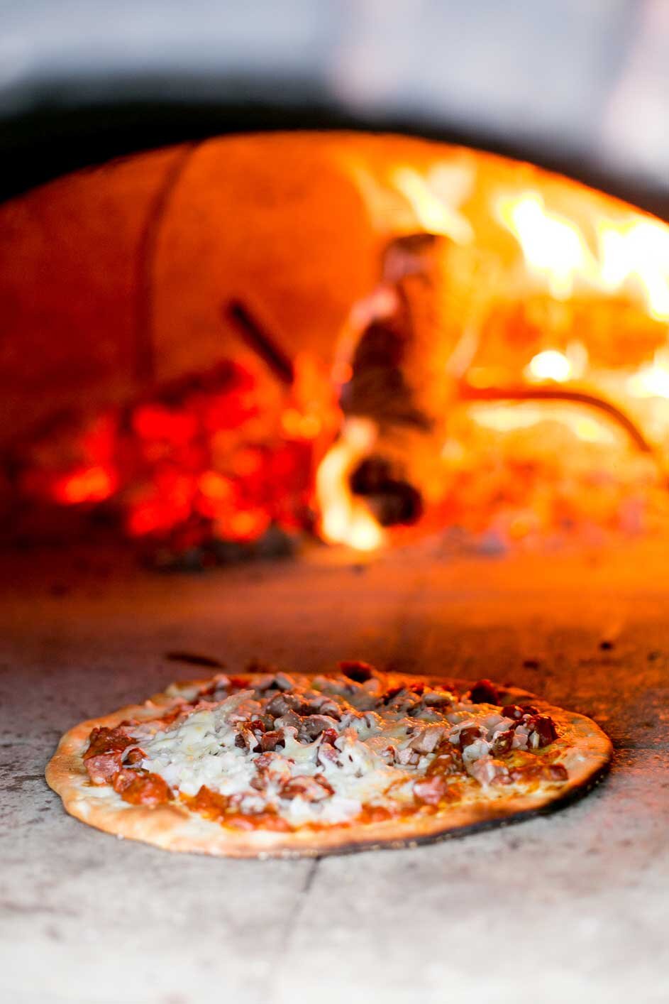 pizza baking in the wood fired oven