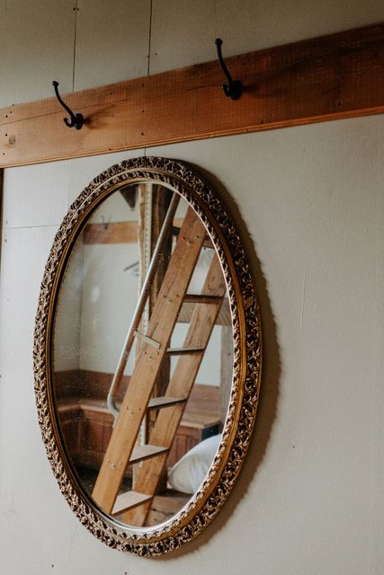 Round mirror and coat rack at Triple S Ranch in Calistoga, California