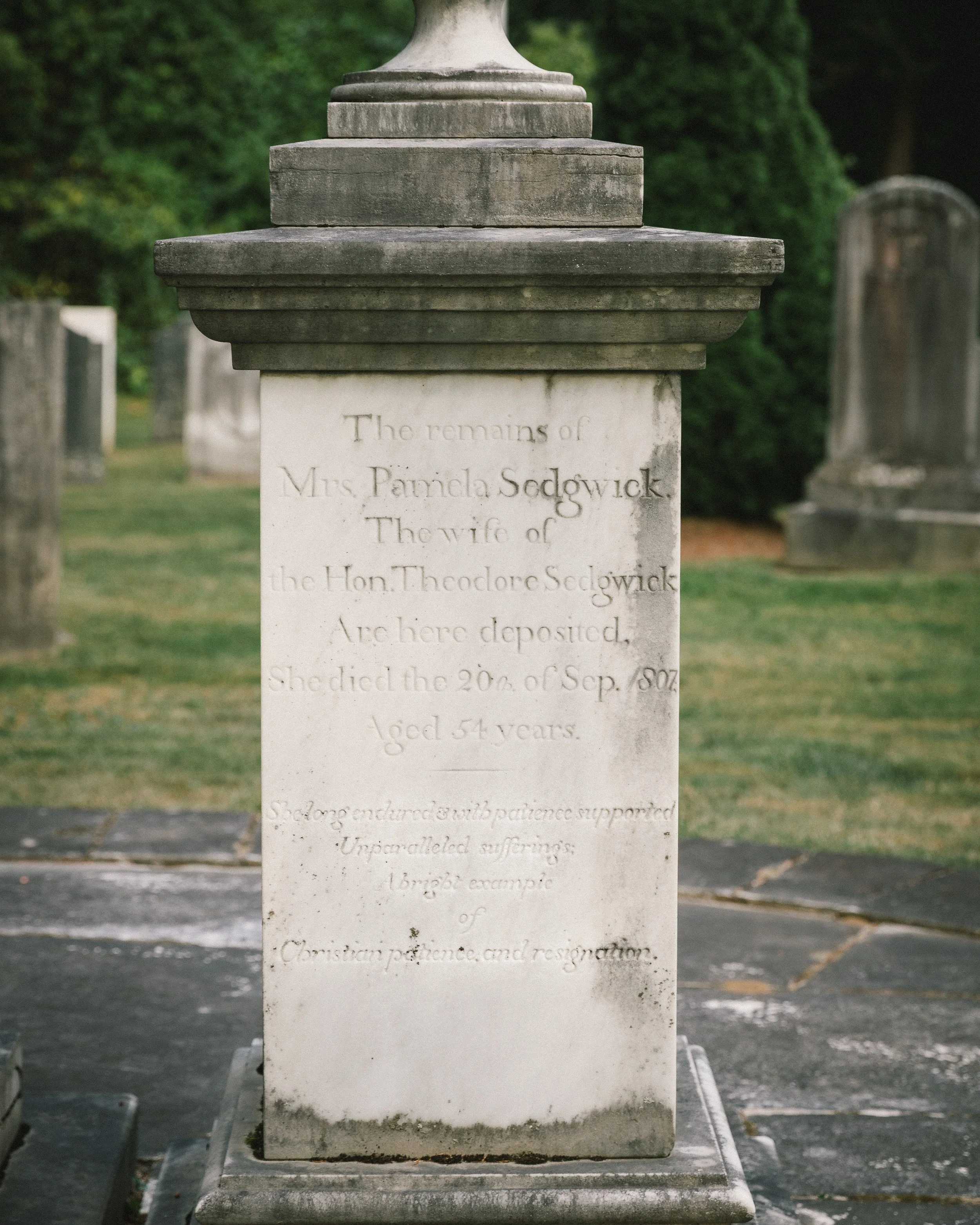 Close view of the gravestone and epitaph marking the final resting place of Pamela Dwight Sedgwick in Stockbridge Cemetery.