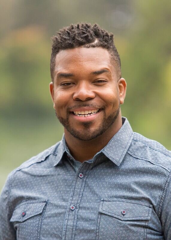 Anthone Headshot smile - Anthone J.jpg