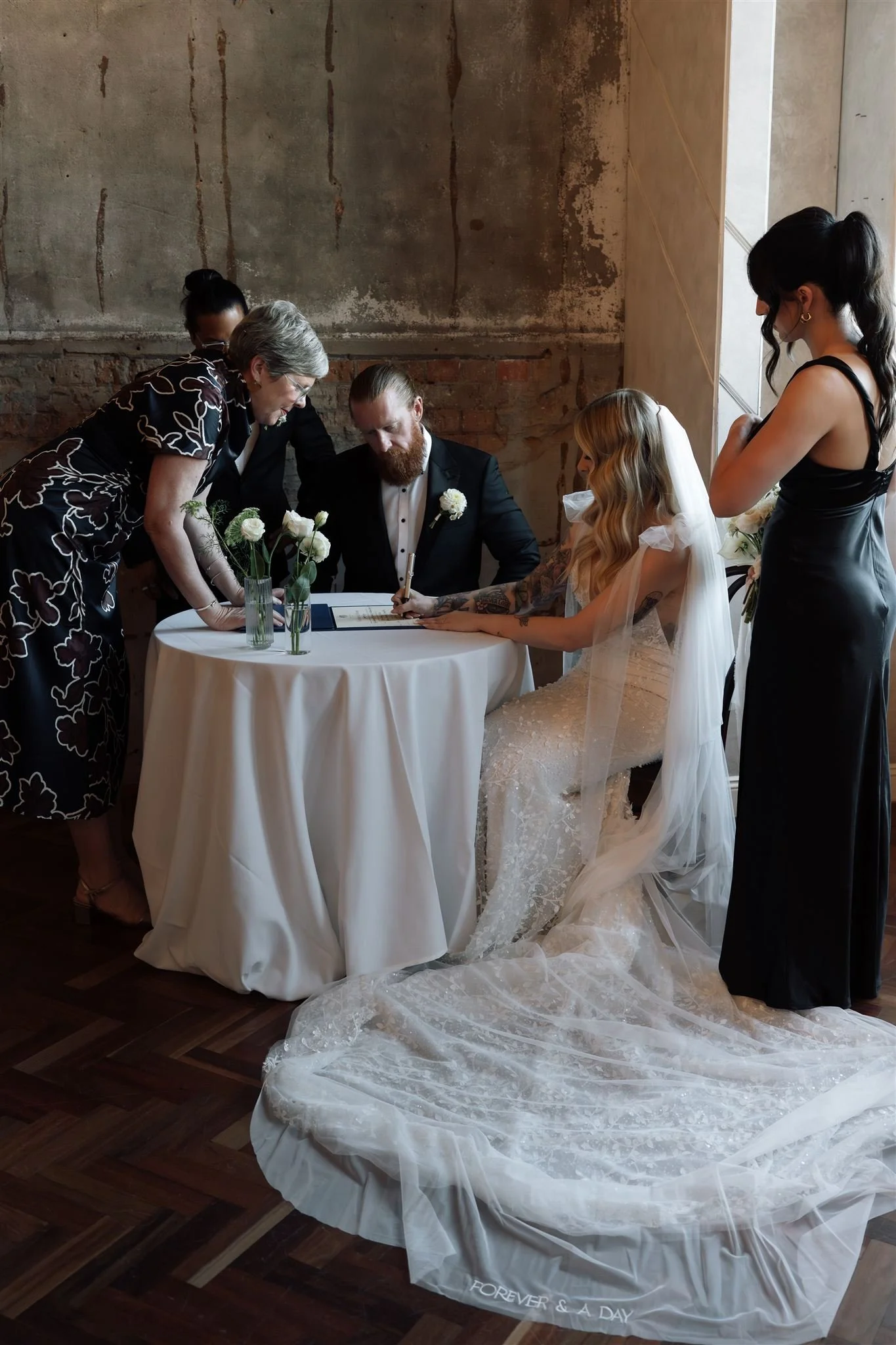 Aaron + Chloe signing.jpg