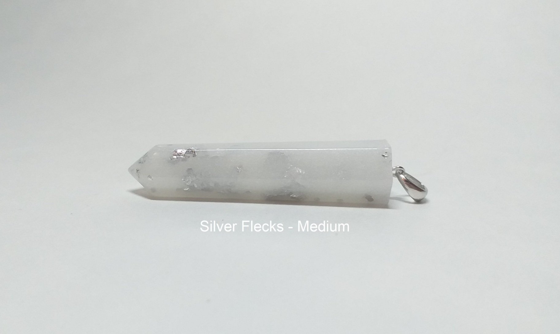 silver+flecks+in+a+crystal+pendant+text.jpg