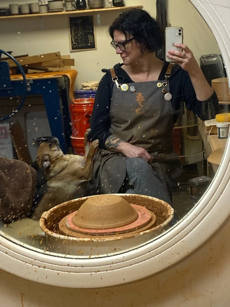 Valerie sitting at pottery wheel