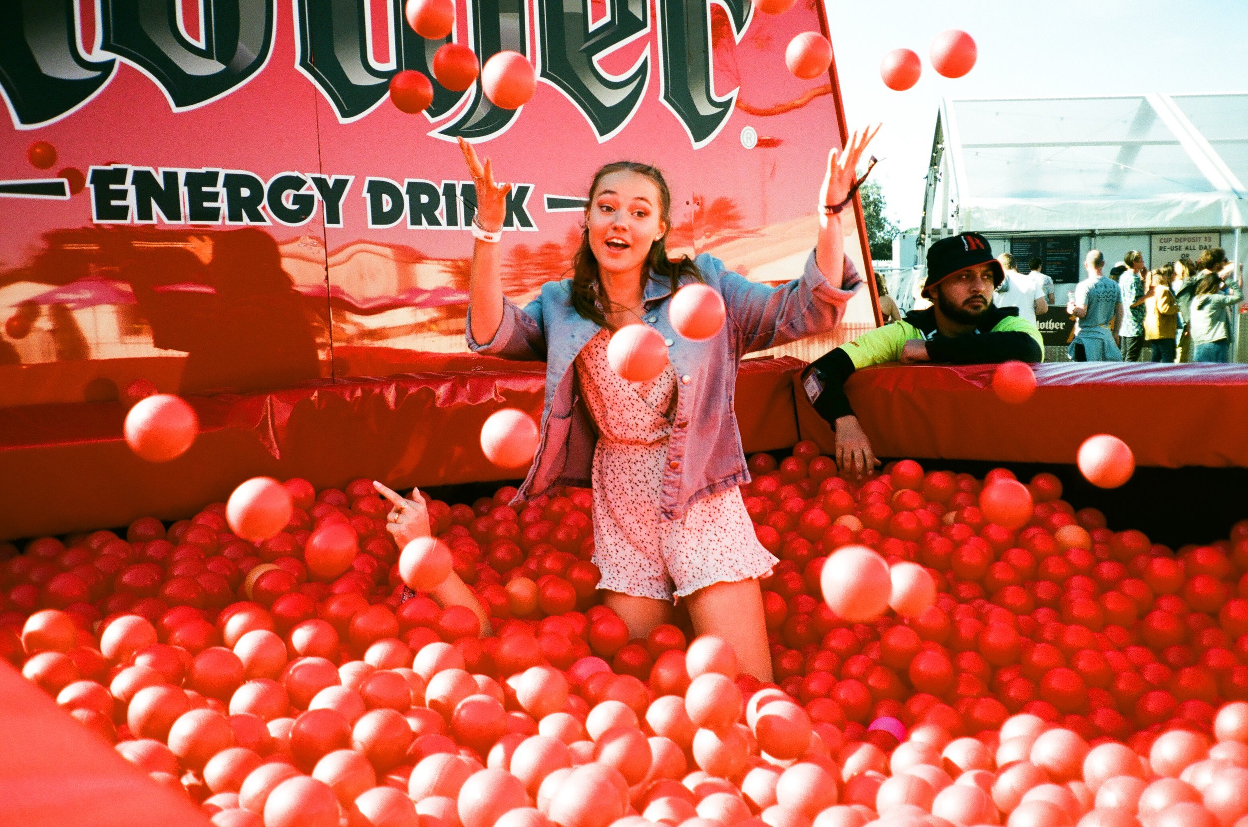 Georgie in the Mother of all ball-pits. Can you find the orange ball? Bonus points if you can spot Em (or her hand, at least).