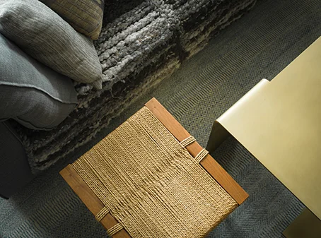 Various textures of couch, stool, coffee table