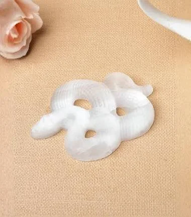 3” carved selenite snake.jpeg