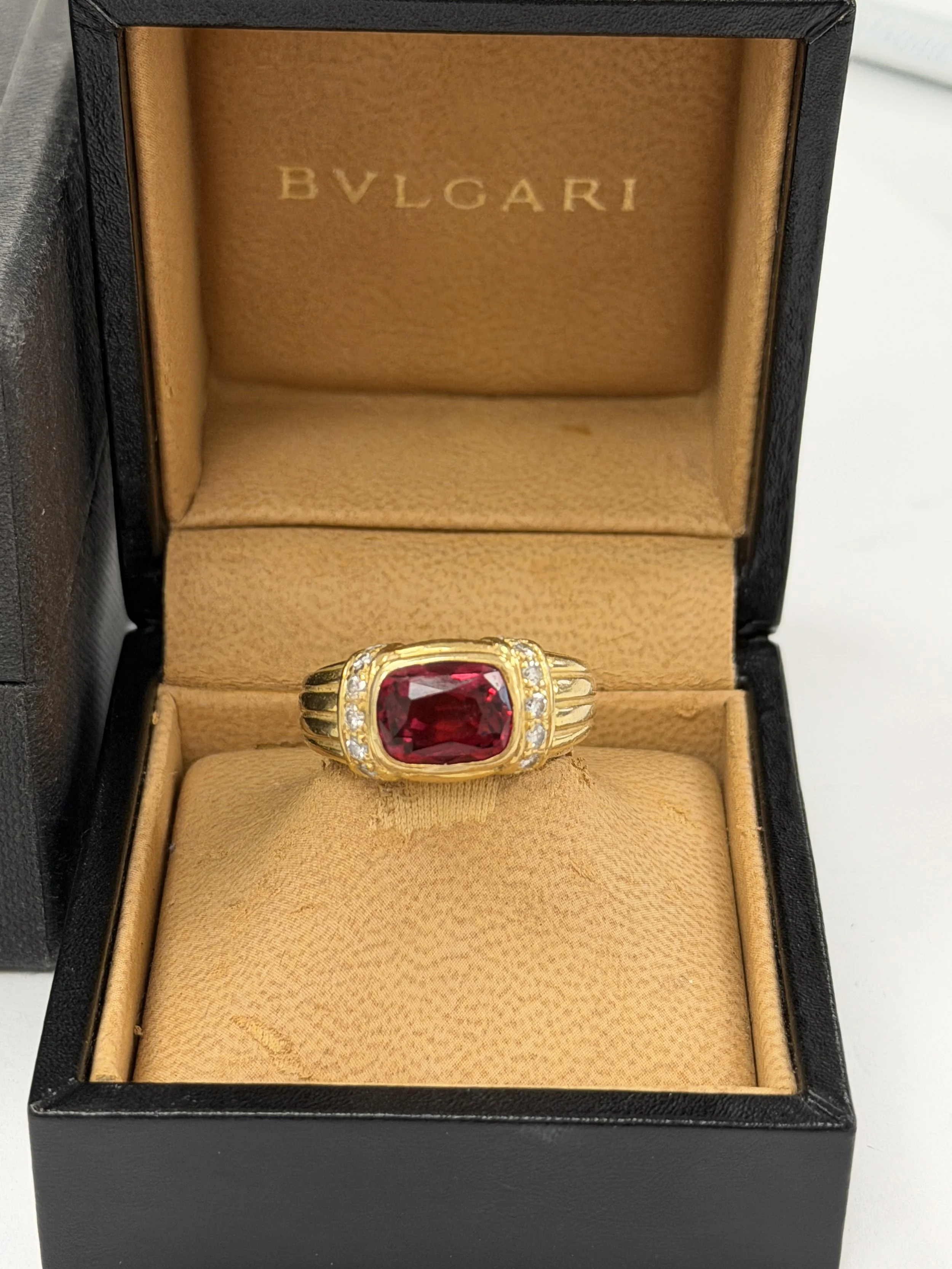 BVLGARI MENS 18K GOLD RING WITH DIAMONDS AND RUBELITE GEMSTONE.  $8995.00