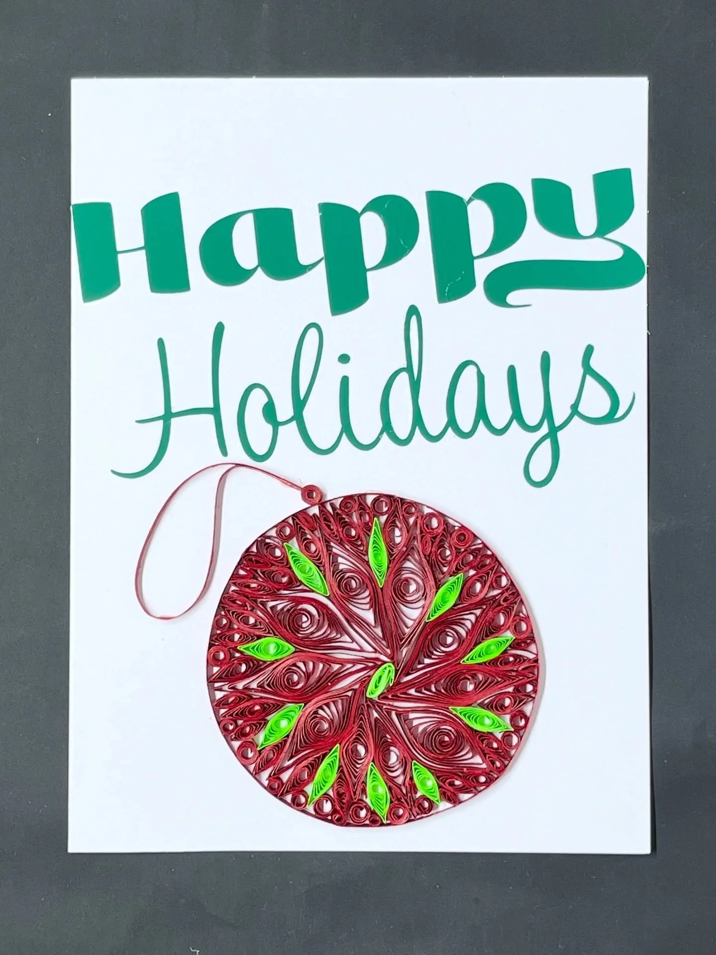 Send the card that will stand out from all the other holiday cards this season! 

Card done by hand, &ldquo;Happy Holidays&rdquo; was made with the #cricut vinyl on cardstock paper. Ornament done by hand using the quilling technique. 

#christmas #ho