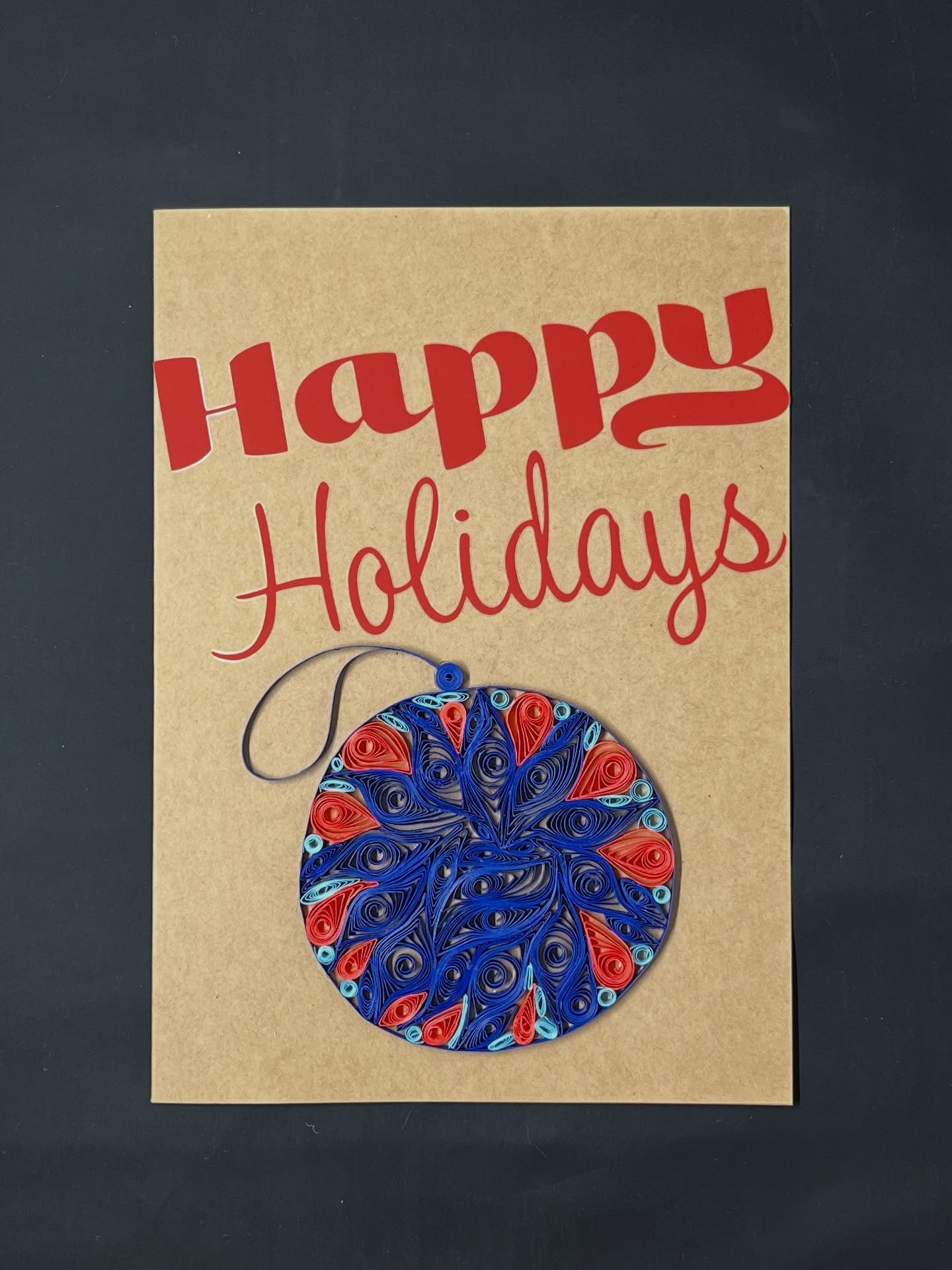 Cards can be customized by different colors in both vinyl and quilling paper. 

Card done by hand, &ldquo;Happy Holidays&rdquo; was made with the #cricut vinyl on kraft cardstock. Ornament done by hand using the quilling technique. 

#christmas #holi