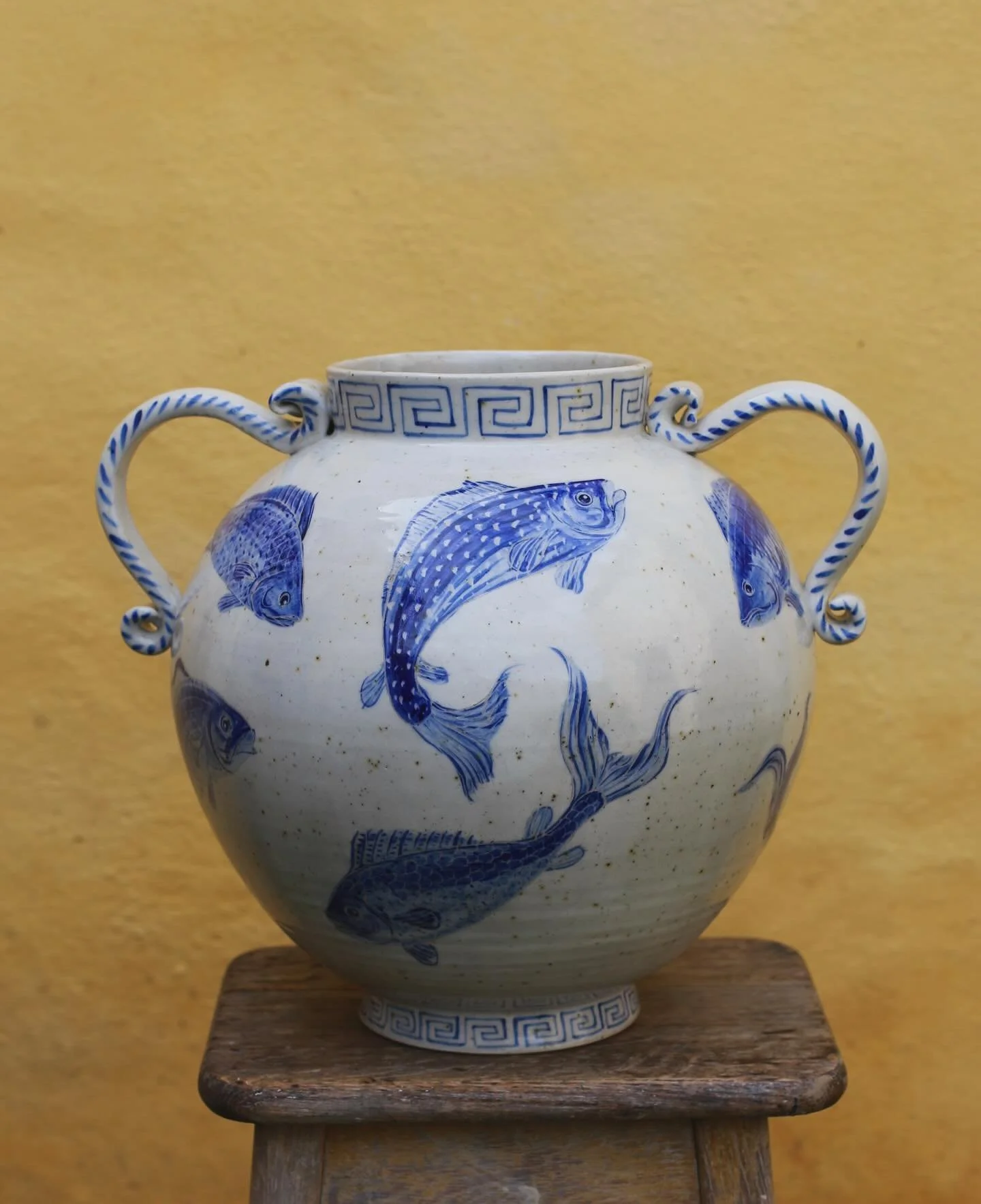 Large fishy vase now fired. Approx 33cm tall she was thrown in two parts with stoneware clay, pulled handles and painted with porcelain slip and cobalt fish. A beauty spot on the middle on one side where the basalt has pushed through the slip but for