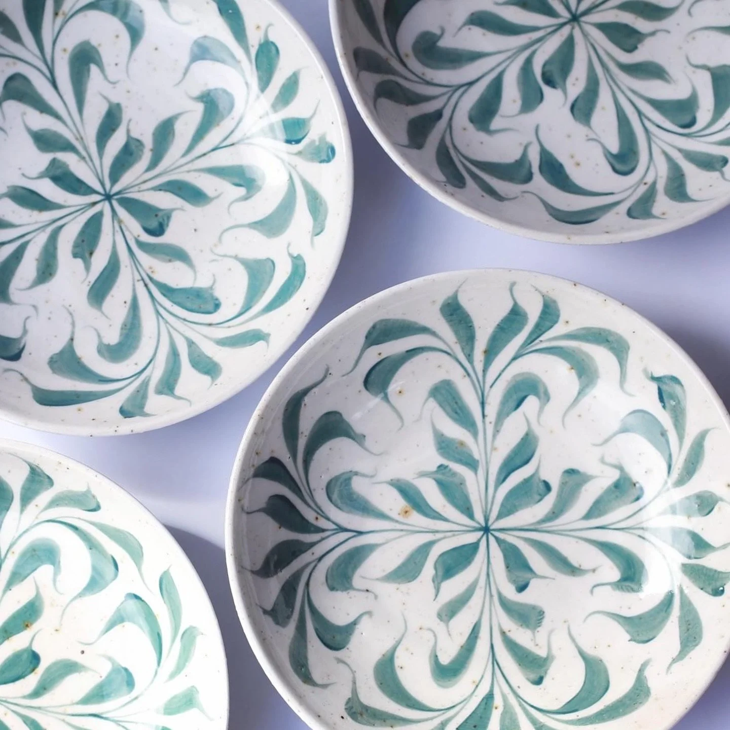 Ye olde faithful, green leaf bowls. Hand painted with green slip on top of porcelain slip on top of stoneware thrown bowl with basalt to give the lovely freckles