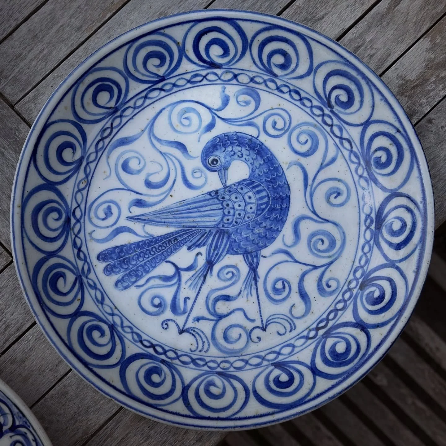 Fresh out the kiln. Big bird platter speckled stoneware with porcelain slip.  Inspired by late medieval tinglazed majolica pottery. swipe to see a bit of the making process and how it changes from the fresh cobalt slip to after it&rsquo;s fired, plus