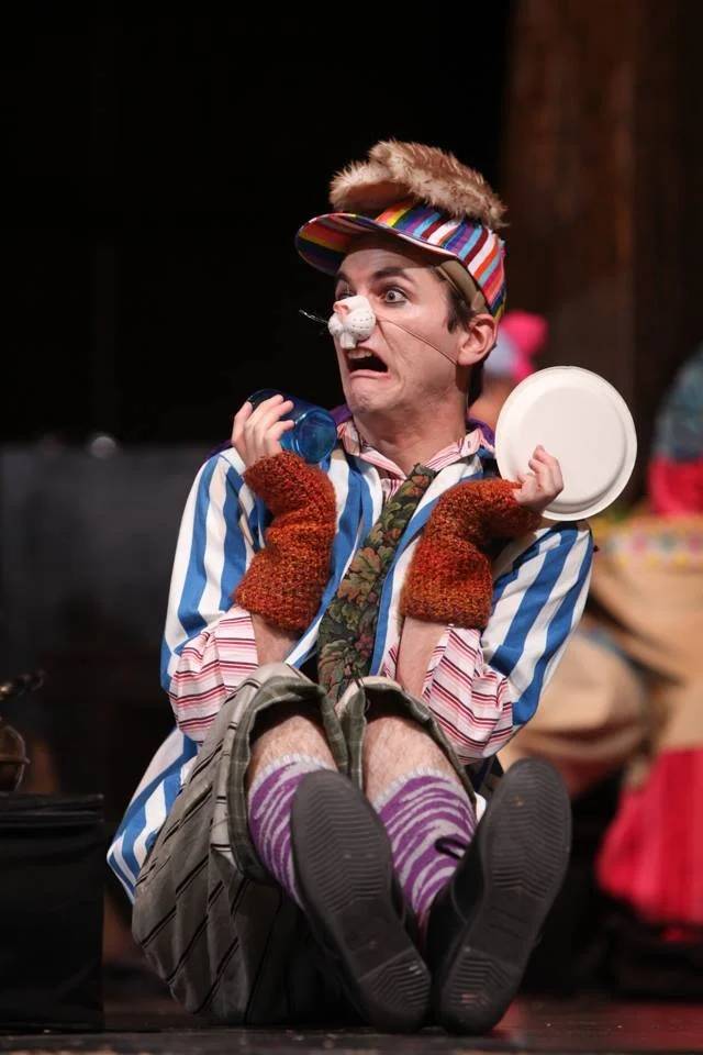 Tony Garcia performing in costume on stage