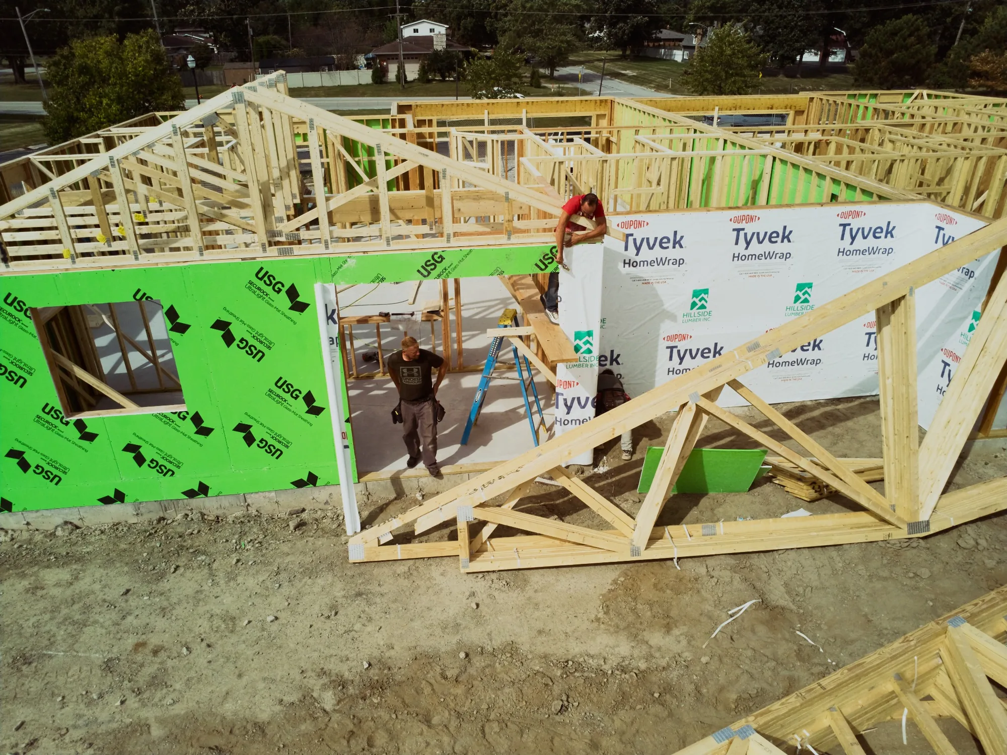 Progress of Expert Building Maintenance, Inc's Ground up construction project of a residential duplex. Wood framing nearly completed.