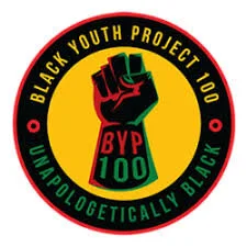 Black fist with red and green outline with "BYP100" on it, in the middle of a circle that has text reading "BLACK YOUTH PROJECT 100" and "UNAPOLOGETICALLY BLACK"