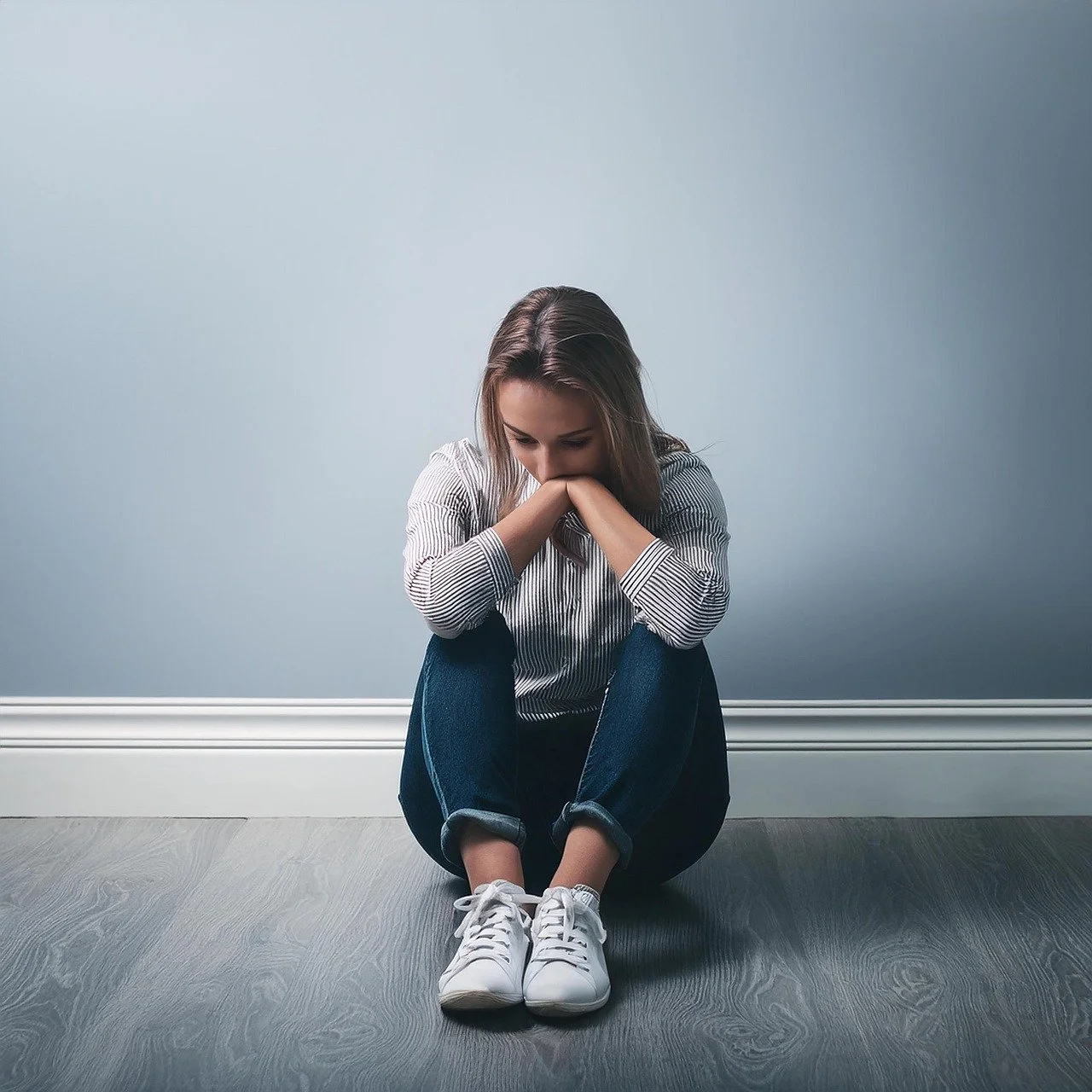 Anxious young person huddled.jpg