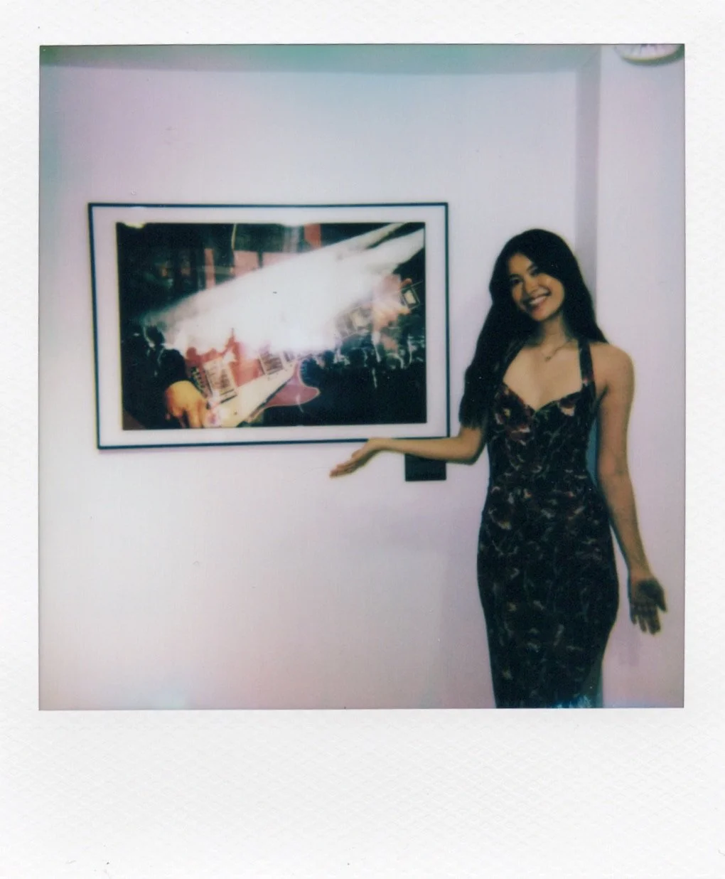 Katelyn Luu New York City photographer standing with her photo at house of jpg gallery event