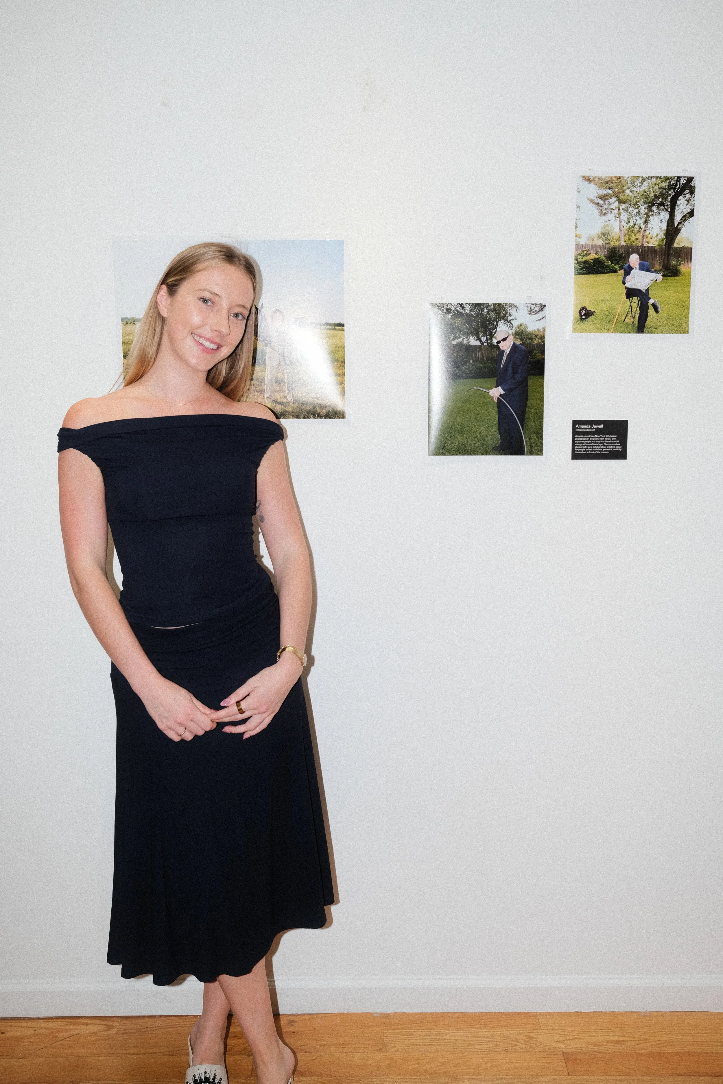 Amanda jewell in front of her photography at house of jpg gallery event