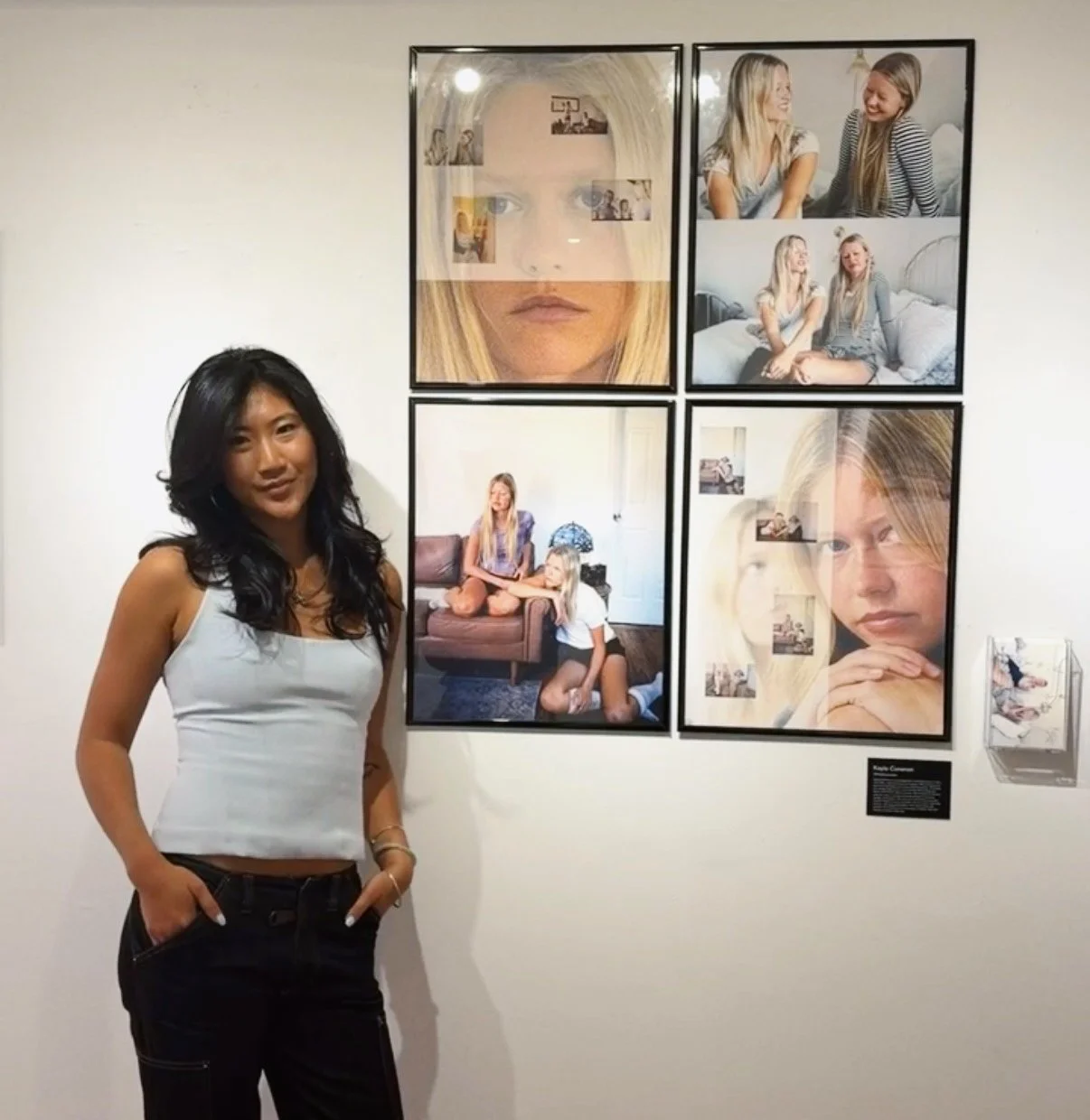 Kayla Cunanan nyc photographer standing with her photos at house of jpg gallery event