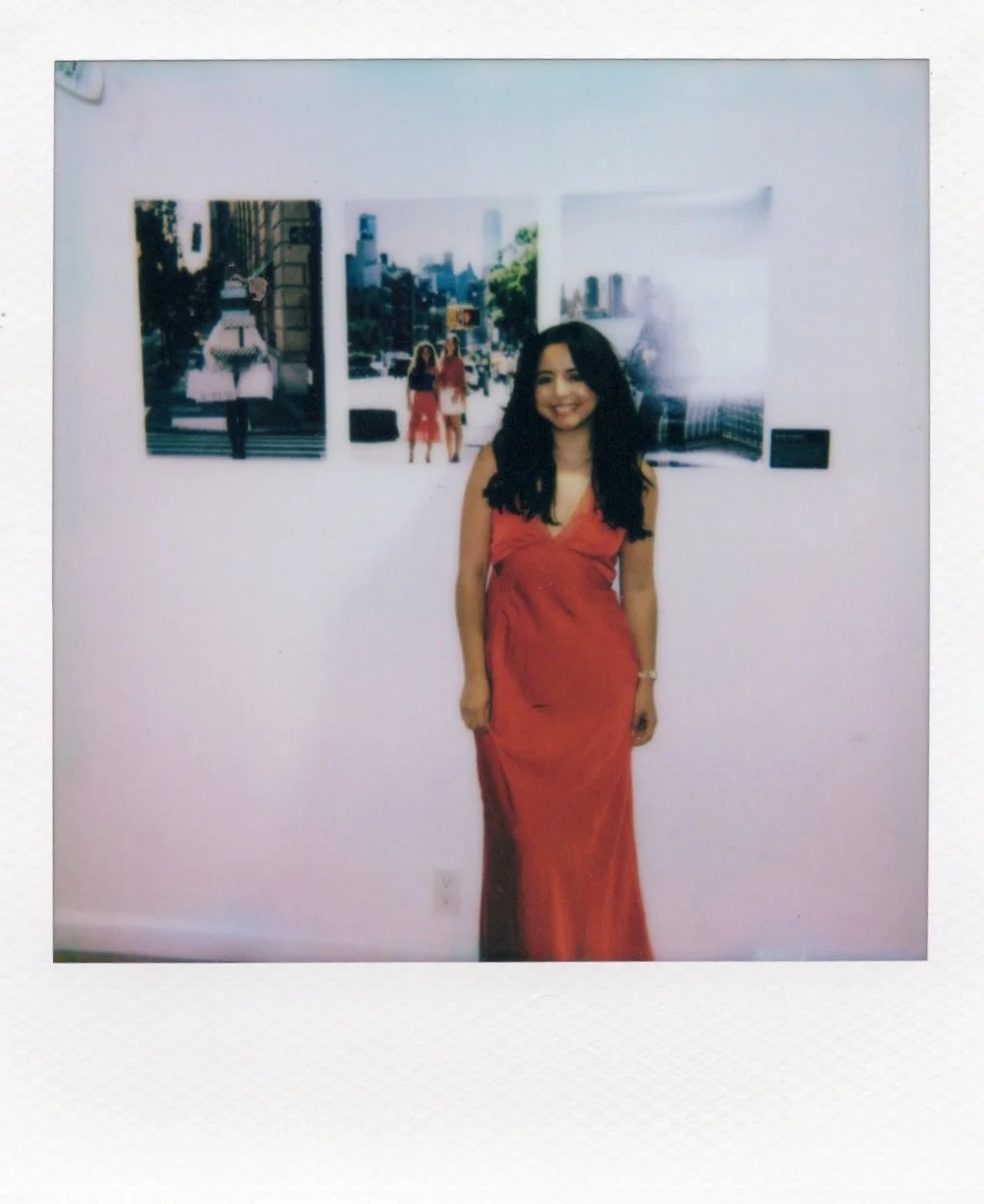 ursula Vasquez urcavaphoto standing with her photos at house of jpg gallery event in New York City
