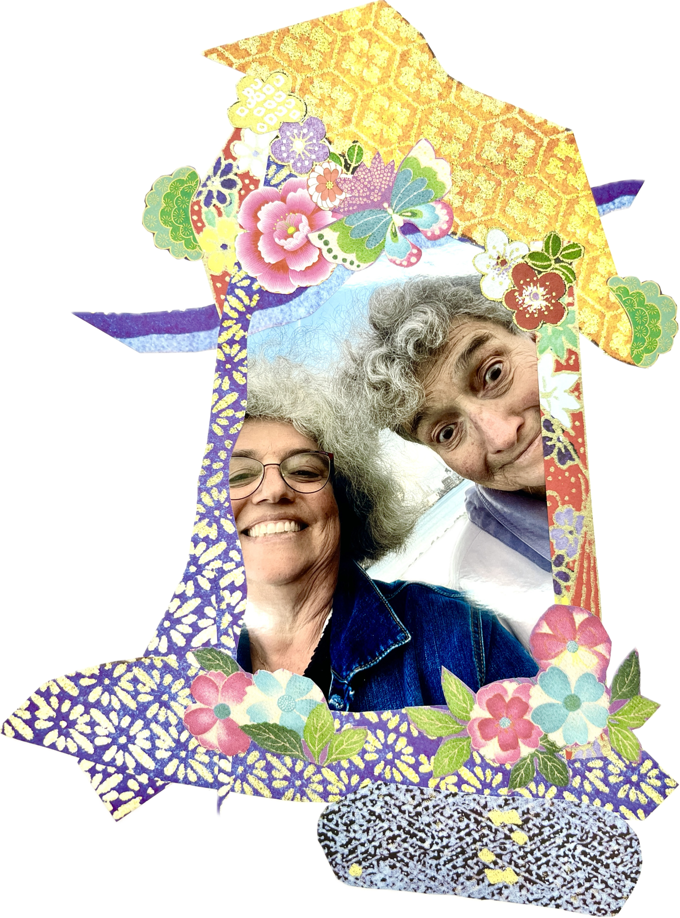 Two people smiling for a selfie, framed by a decorative Japanese-style paper cutout with colorful floral and butterfly patterns.