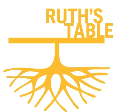 Graphic design featuring the text "RUTH'S TABLE" in yellow, with a stylized yellow tree root beneath the text.