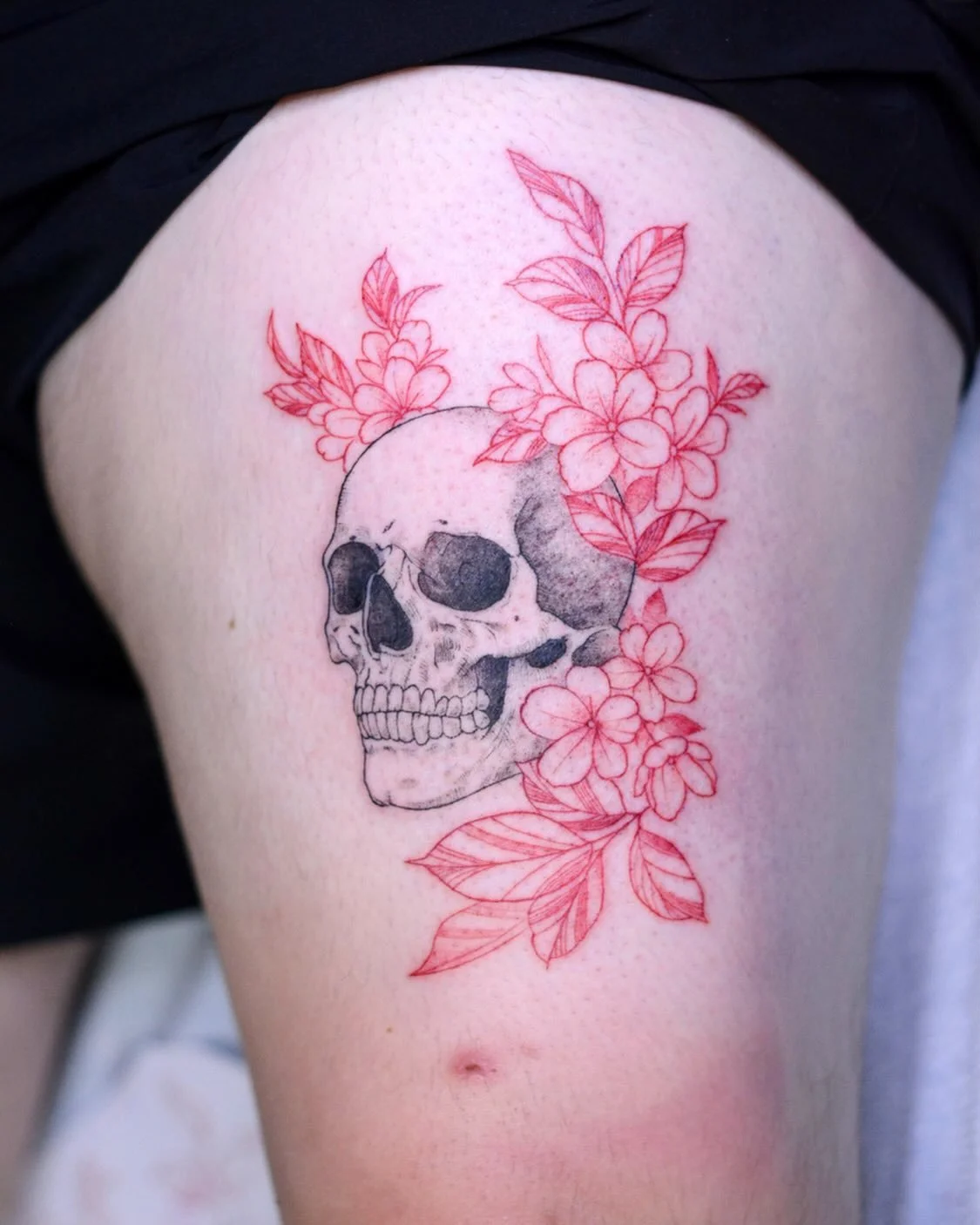 💀 💐- booking link in bio. 
.
.
.
#skulltattoo #flowertattoo #tattooing #tattooist #tattooart