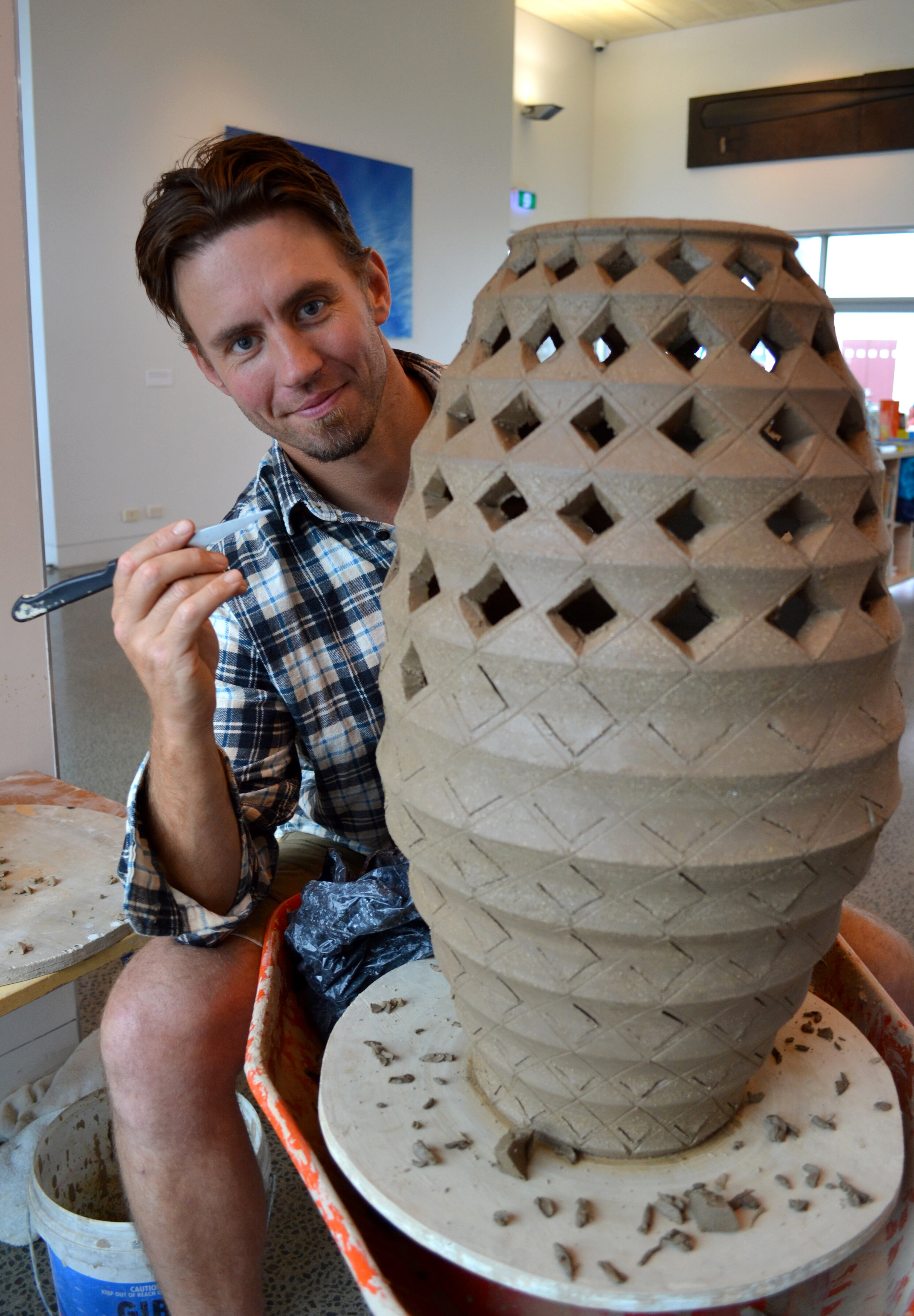 Sam Ludden at work on his ceramic hinaki.jpg
