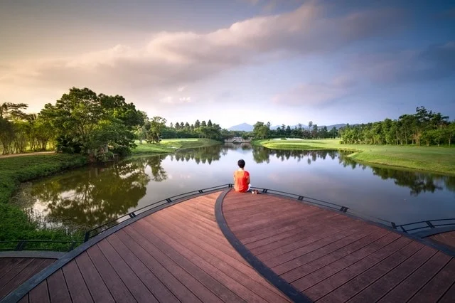 Satu-Korby-lake-dock-person-trees-clouds-min.jpg