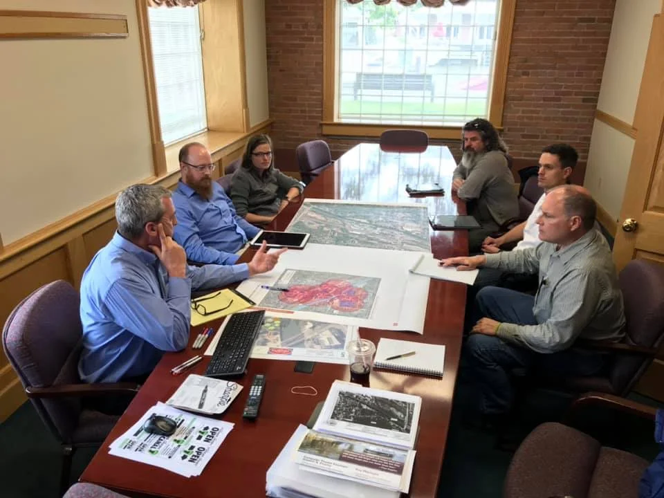 Design Committee holds a charette to plan alternate traffic and pedestrian routes during the upcoming liftbridge reconstruction project. L-R Andy Spencer, Andy Martin, Jessica Kruse, Joel Cuminale, David Kruse, and Randy Sickler.