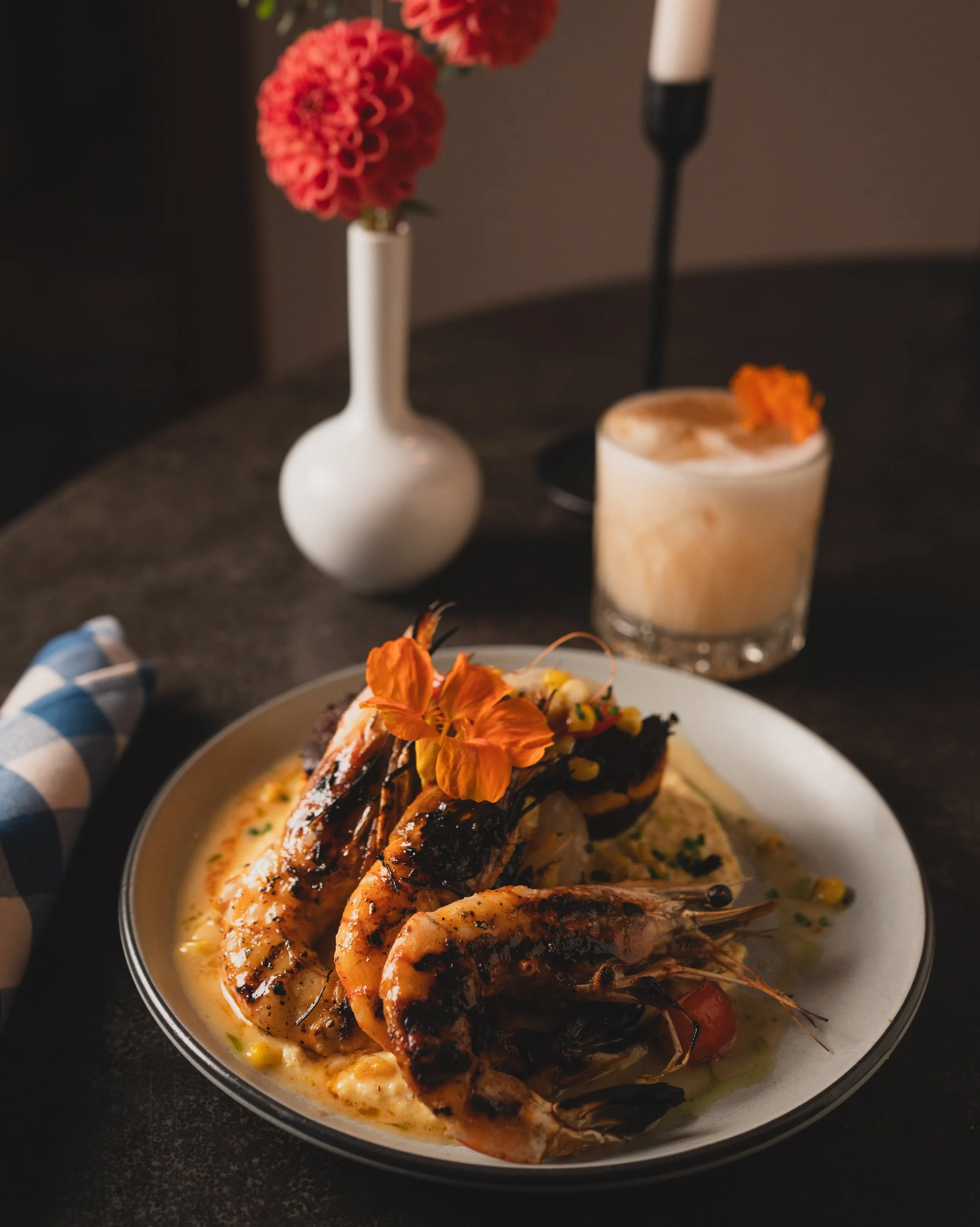 Pull the shell, drag it through the Old Bay beurre blanc, then go back for the crispy edge of the polenta cake. Head-on shrimp, crispy polenta cake, sweet corn pur&eacute;e, Old Bay beurre blanc. On special now.