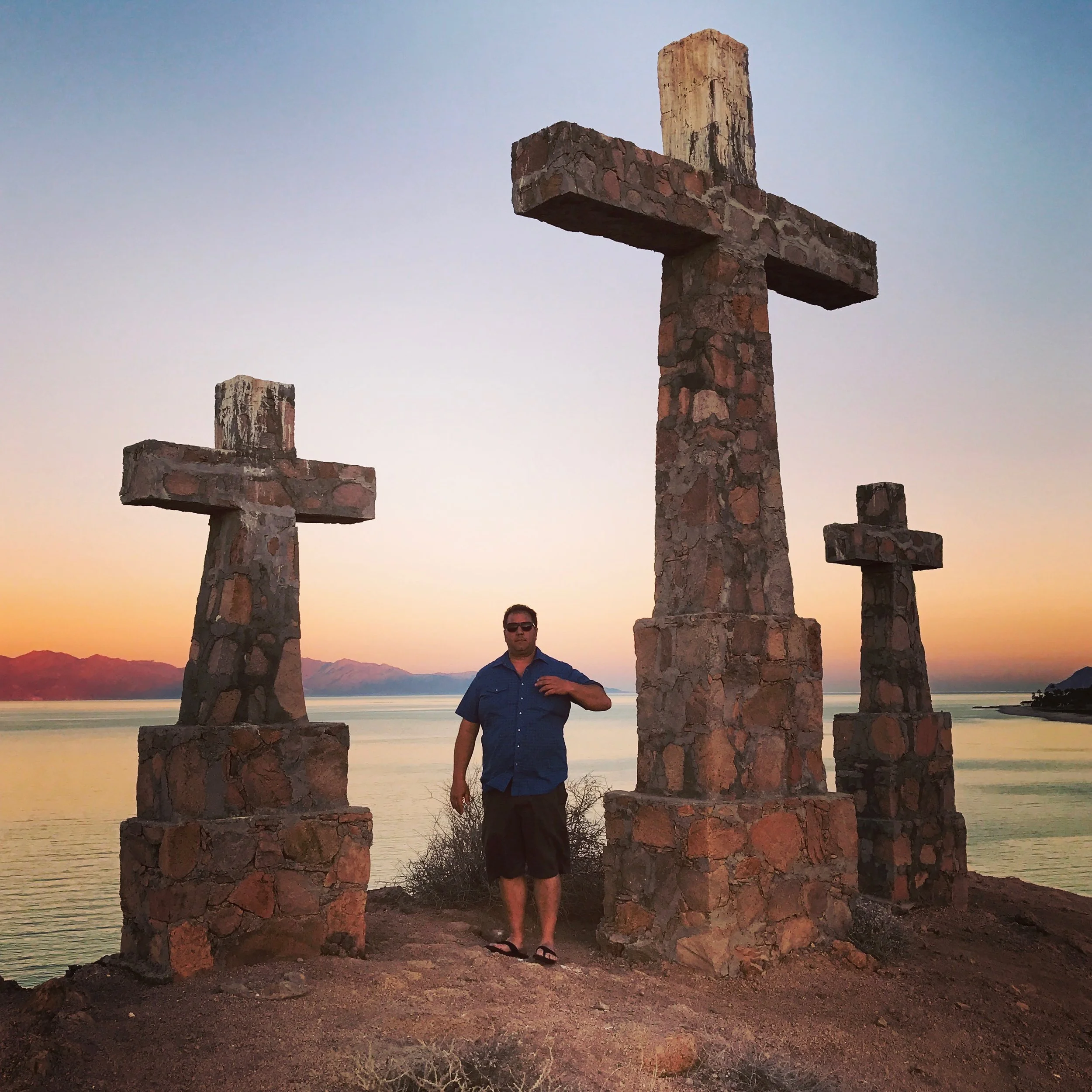 Rick Marino in front of Rancho Las Cruces' crosses.