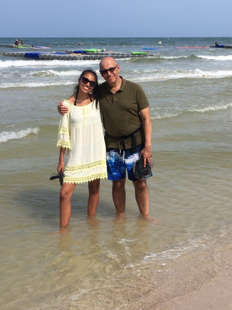 Isabella on holiday in Thailand in 2018, pictured standing in the sea with her father. Photo: Isabella Lock