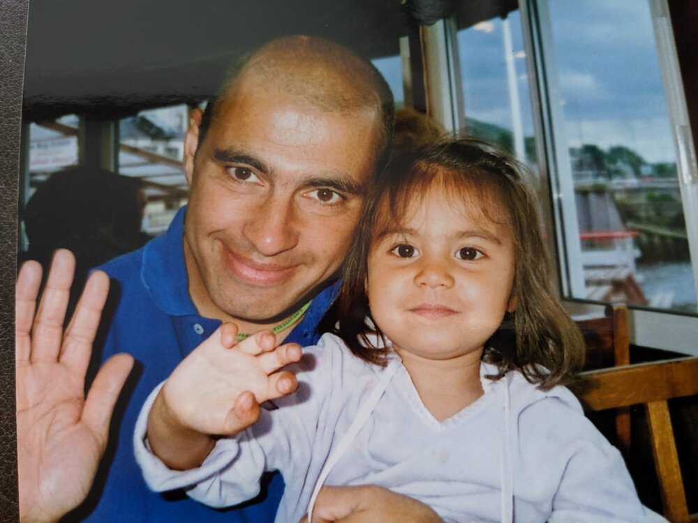 Isabella, aged 5, pictured smiling and waving alongside her father. Photo: Isabella Lock