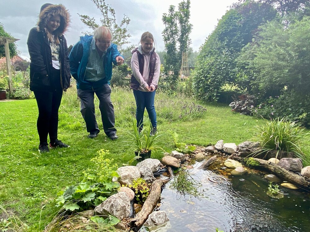 Nigel Sharples_Nigel with granddaughters Catie and Ellie looking for wildlife in the pond_Credit_ Tom Sharples .jpeg