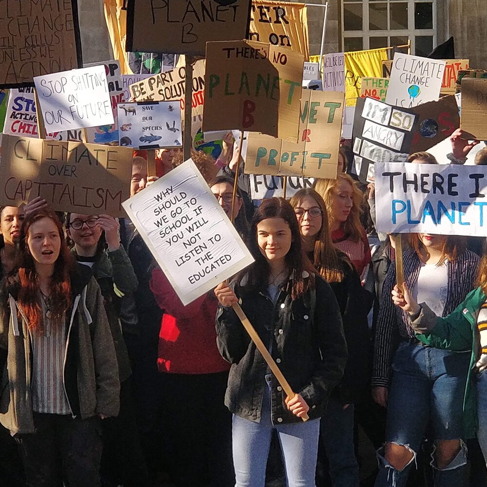 Emma (centre) during a climate strike. Photo: Youth Strike Manchester