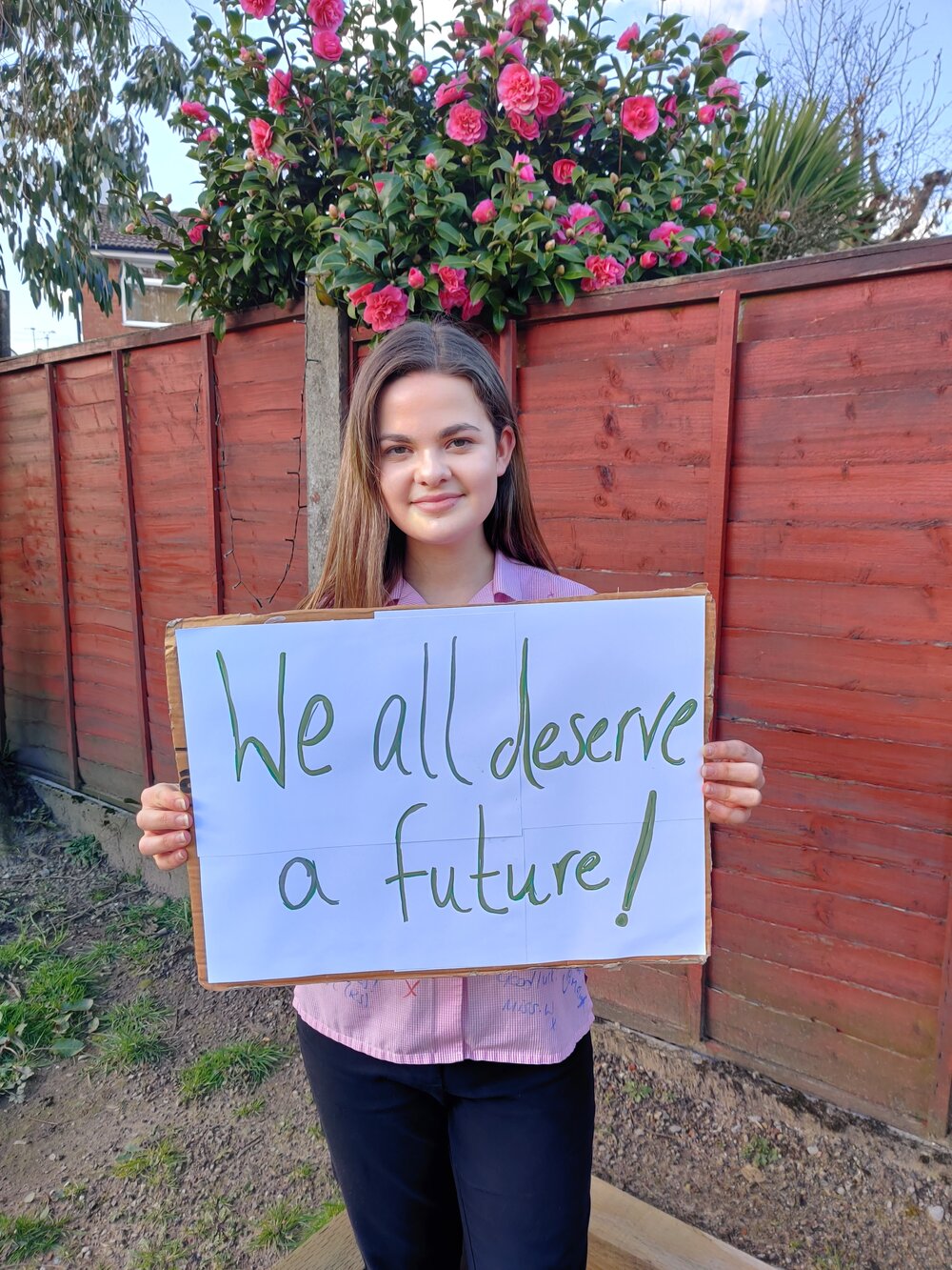Emma Greenwood, 16, holding a sign that says 'we all deserve a future.' Photo: Emma Greenwood
